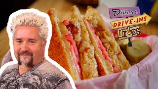 Guy Fieri Tries CRAB CAKE Grilled Cheese  Diners Driveins and Dives with Guy Fieri  Food Network [upl. by Asirb]