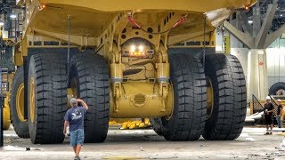 Moving a massive Caterpillar 794AC dump truck [upl. by Hamrnand606]