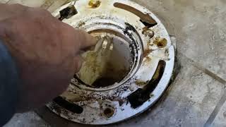 Replacing a Toilet Flange on a Tile Concrete Floor Part 1 [upl. by Elram498]