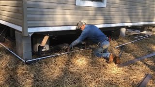 Installing skirting on mobile home [upl. by Anaitsirk632]