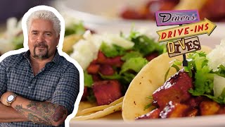 Guy Fieri Eats Some OUTSTANDING Tacos Al Pastor  Diners DriveIns and Dives  Food Network [upl. by Fanni]